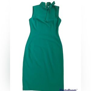 I wear this Calvin Klein green dress to a wedding, not a big fan of the neck.